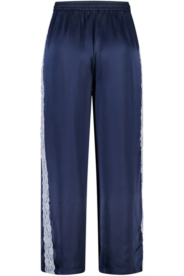 Pantalon avec détails en dentelle sur les côtés